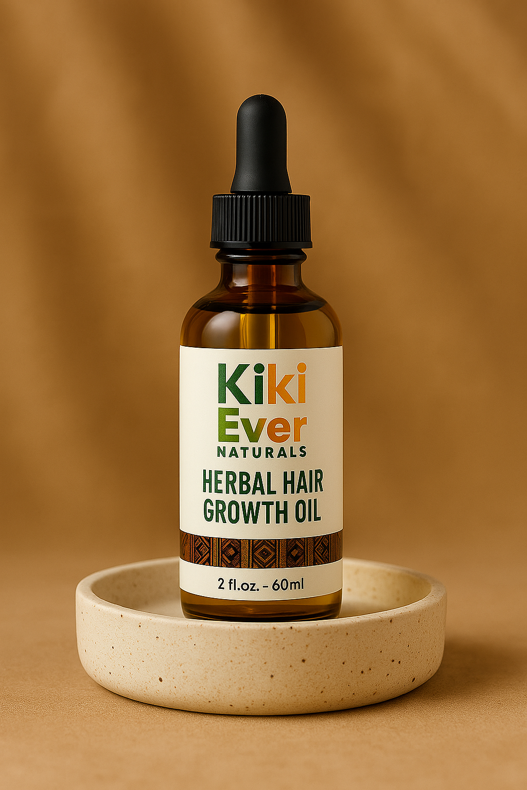 Kiki Ever Naturals herbal hair growth oil bottle on a beige dish with a brown background