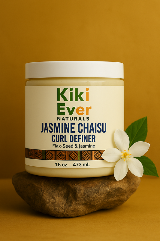 Jar of Kiki Ever Naturals Jasmine Chaisu Curl Definer on a stone with a flower against an orange background