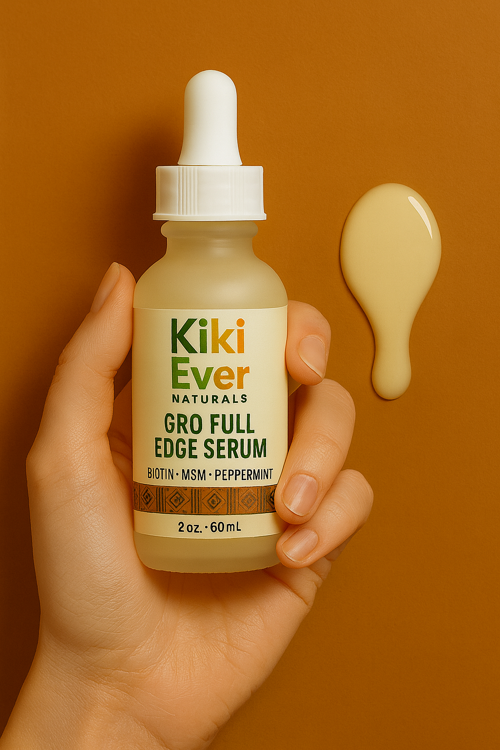 Hand holding a bottle of Kiki Ever Naturals Gro Full Edge Serum with a dropper on an orange background.