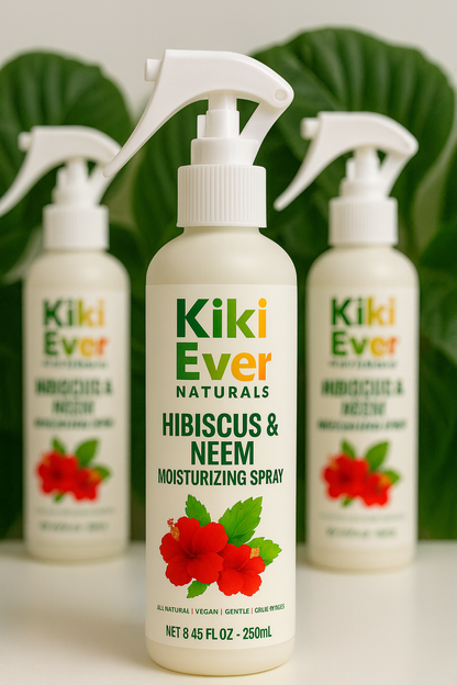 Kiki Ever Naturals Hibiscus & Neem Moisturizing Spray bottle with two other bottles in the background.